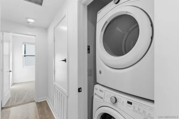 a view of entryway with washer and dryer