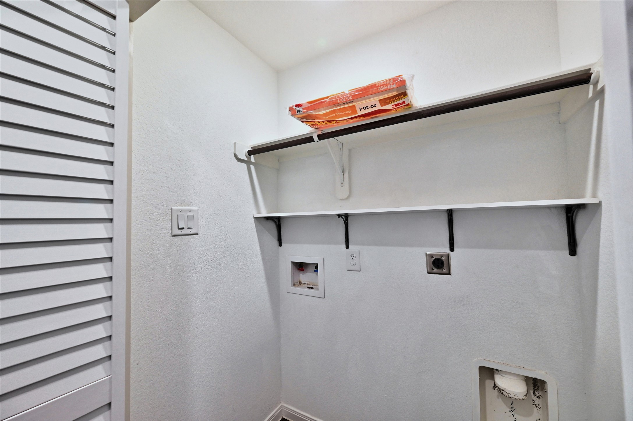 16623 Colleen Place Conroe, TX 77306 - Photo 35 of 44 Laundry room has shelf storage.