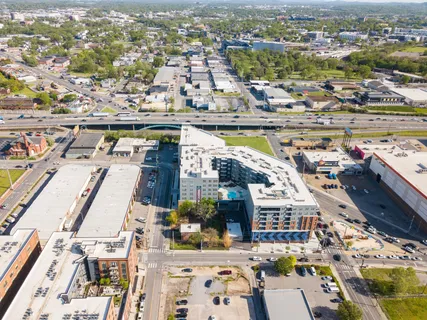 an aerial view of residential houses with outdoor space