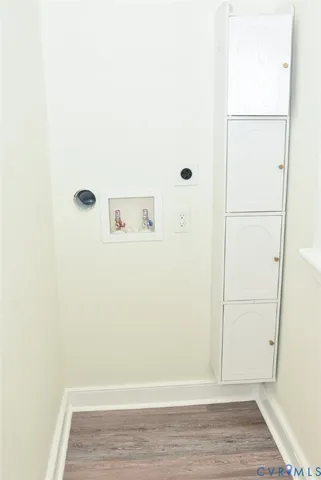 a view of an empty room and wooden floor