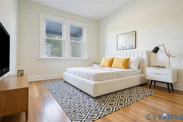 a bedroom with a bed and a couch