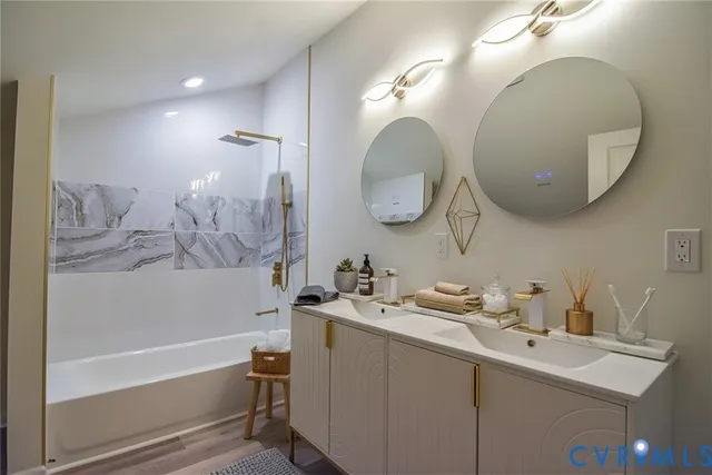 a bathroom with a bathtub and shower