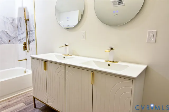 a side view of a house with a wooden fence