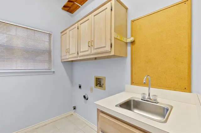 a bathroom with a sink and a window