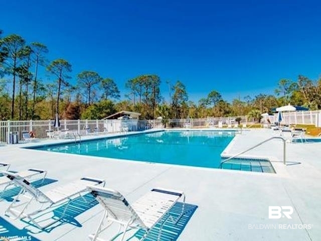 1325 Ridgewood Drive Lillian, AL 36549 - Photo 29 of 32 Community pool featuring a patio area