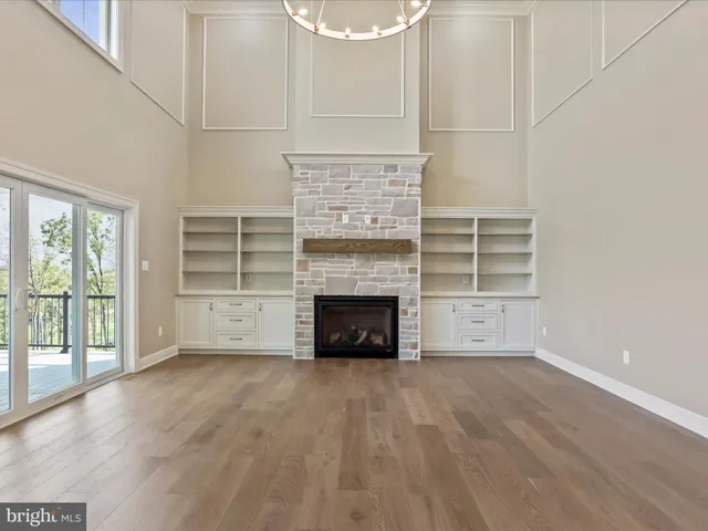 a kitchen with stainless steel appliances granite countertop a sink a stove and cabinets