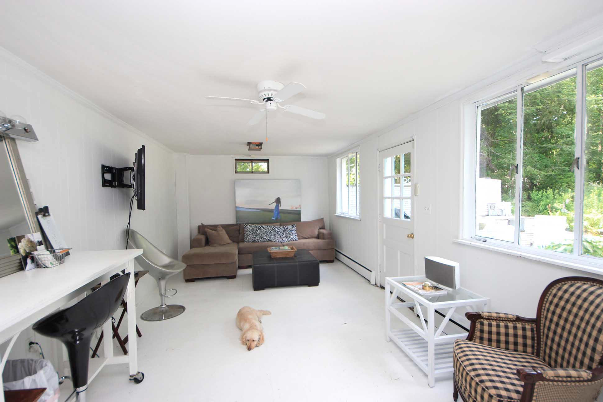 43 Rural Drive New Canaan, CT 06840 - Photo 15 of 26 a living room with furniture and a large window