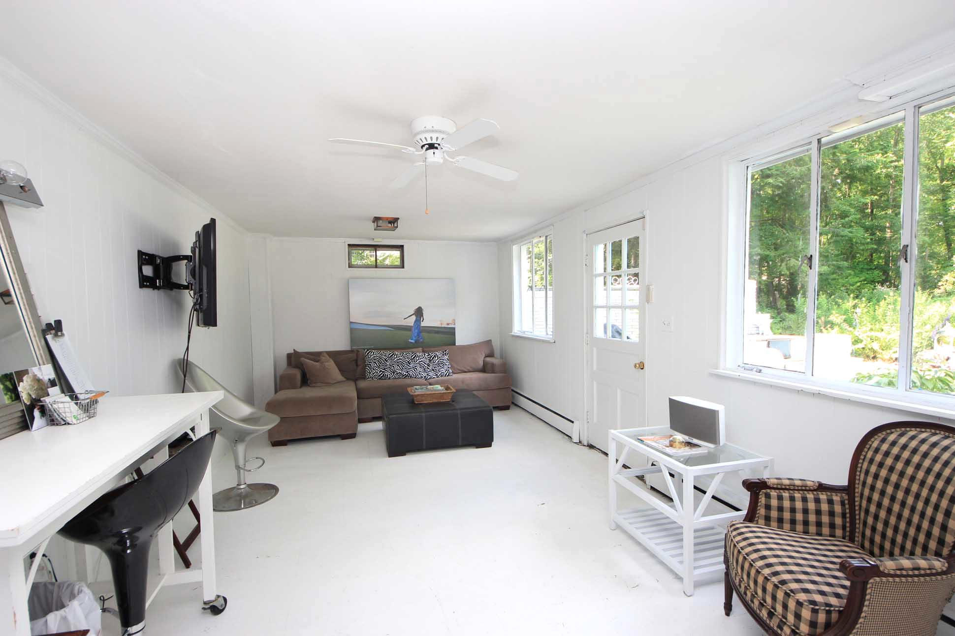 43 Rural Drive New Canaan, CT 06840 - Photo 16 of 26 a living room with furniture and a large window