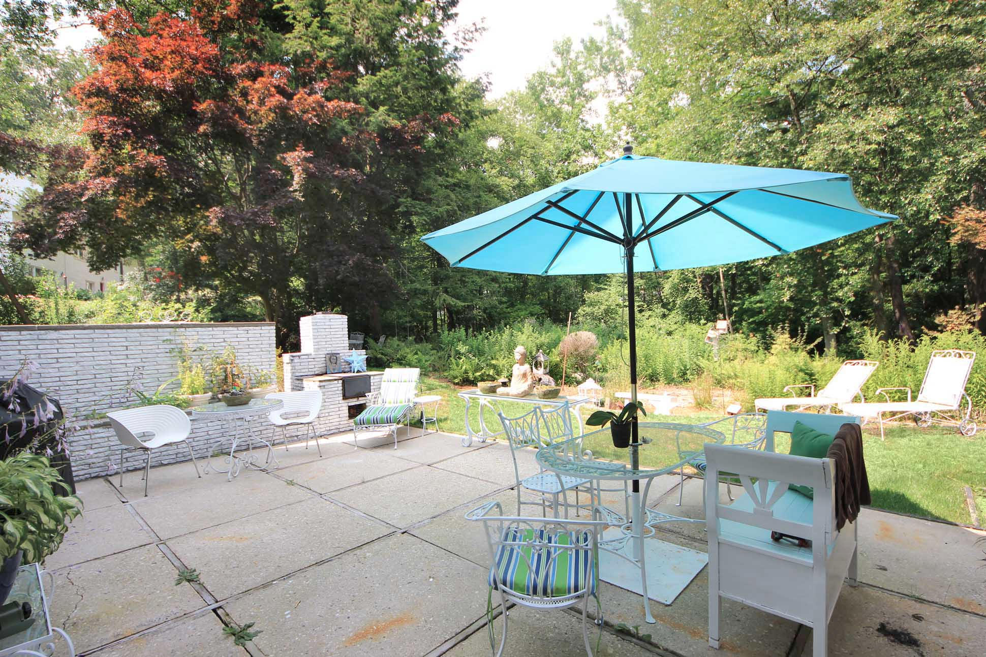 43 Rural Drive New Canaan, CT 06840 - Photo 20 of 26 a view of backyard of house with seating space