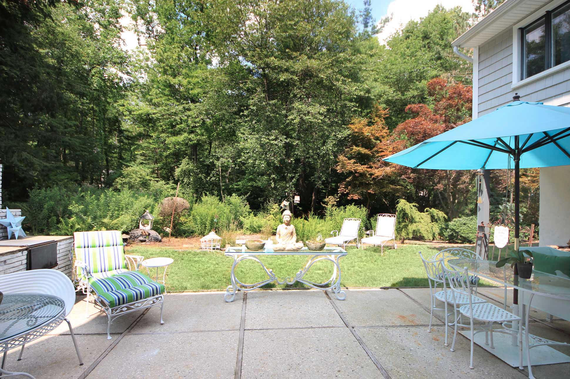 43 Rural Drive New Canaan, CT 06840 - Photo 21 of 26 a view of backyard with seating space and trees