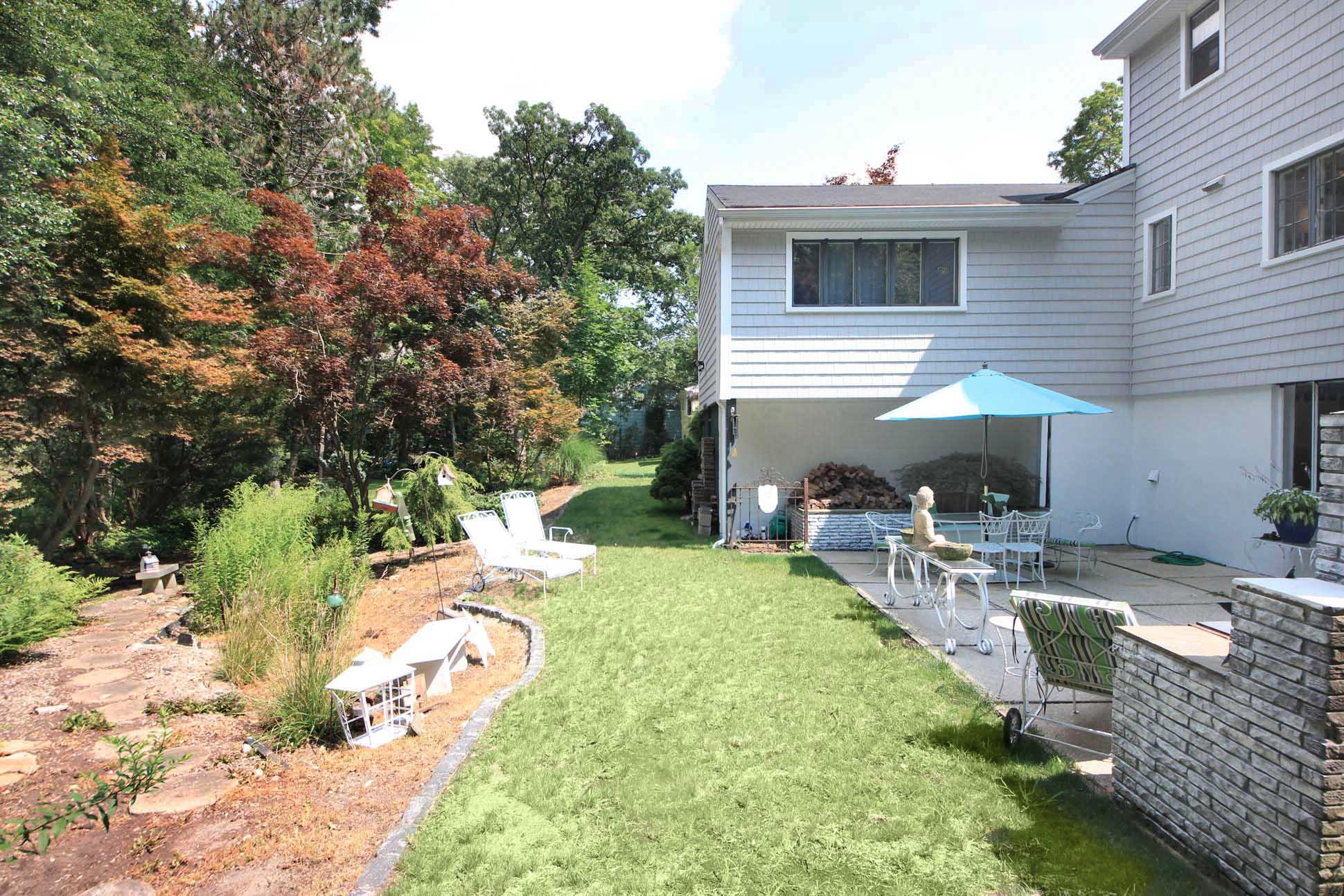 43 Rural Drive New Canaan, CT 06840 - Photo 23 of 26 a view of backyard with patio