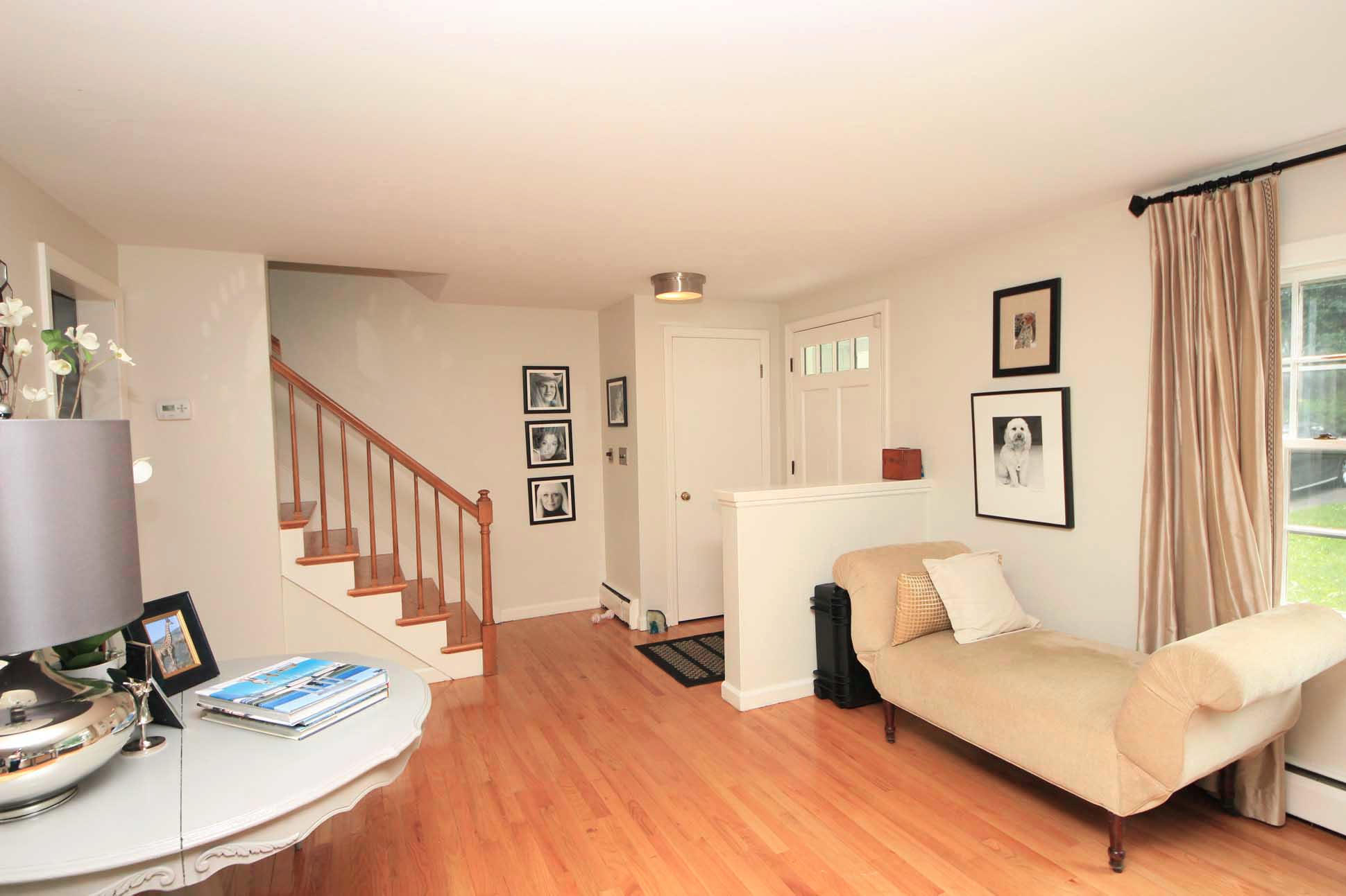 43 Rural Drive New Canaan, CT 06840 - Photo 4 of 26 a living room with furniture and a table