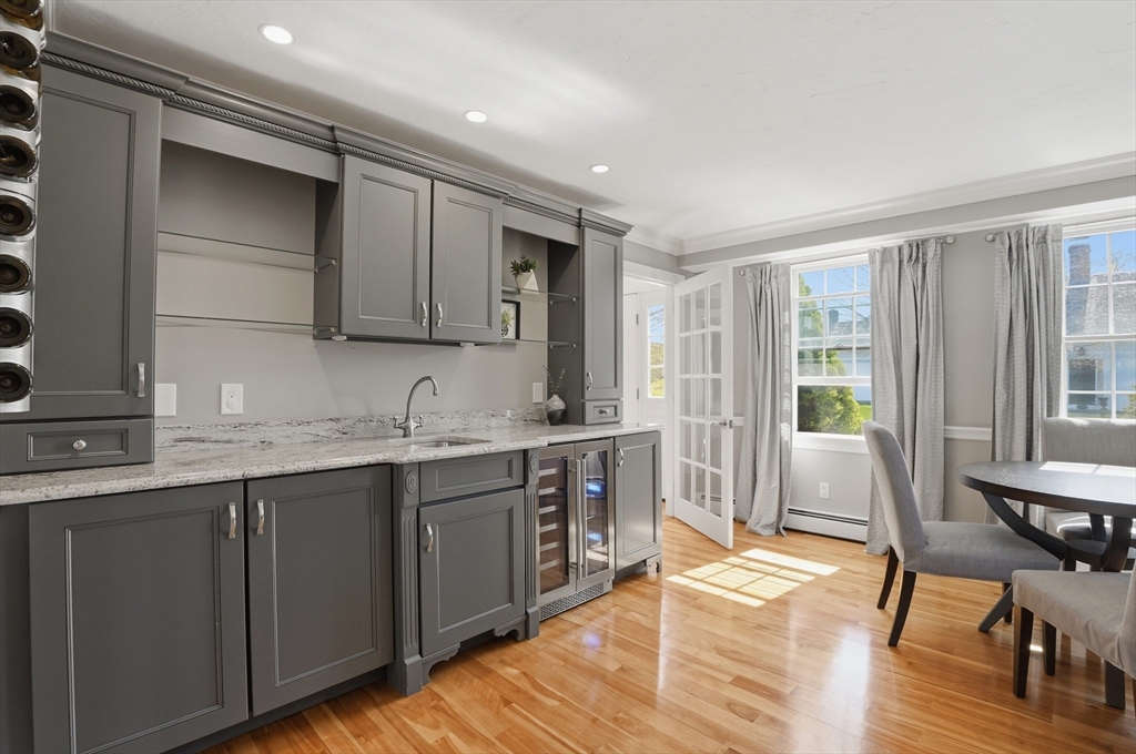 183 Whiting Street Hanover, MA 02339 - Photo 10 of 42 a large kitchen with granite countertop a sink and cabinets