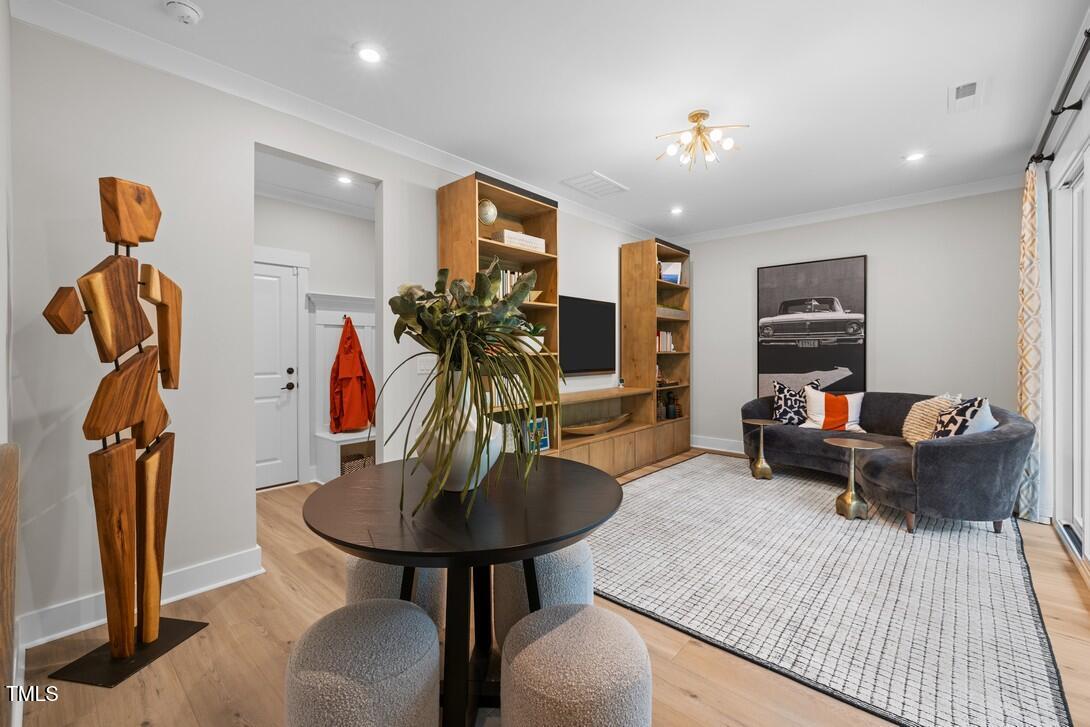4504 Mint Leaf Lane Raleigh, NC 27612 - Photo 11 of 42 a living room with furniture and a wooden floor