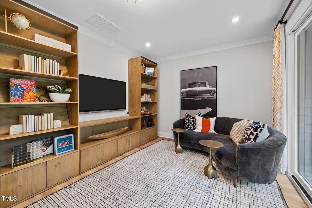 4504 Mint Leaf Lane Raleigh, NC 27612 - Photo 12 of 42 a living room with furniture and a flat screen tv