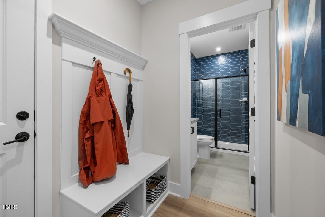4504 Mint Leaf Lane Raleigh, NC 27612 - Photo 16 of 42 a view of walk in closet with clothes and shoes