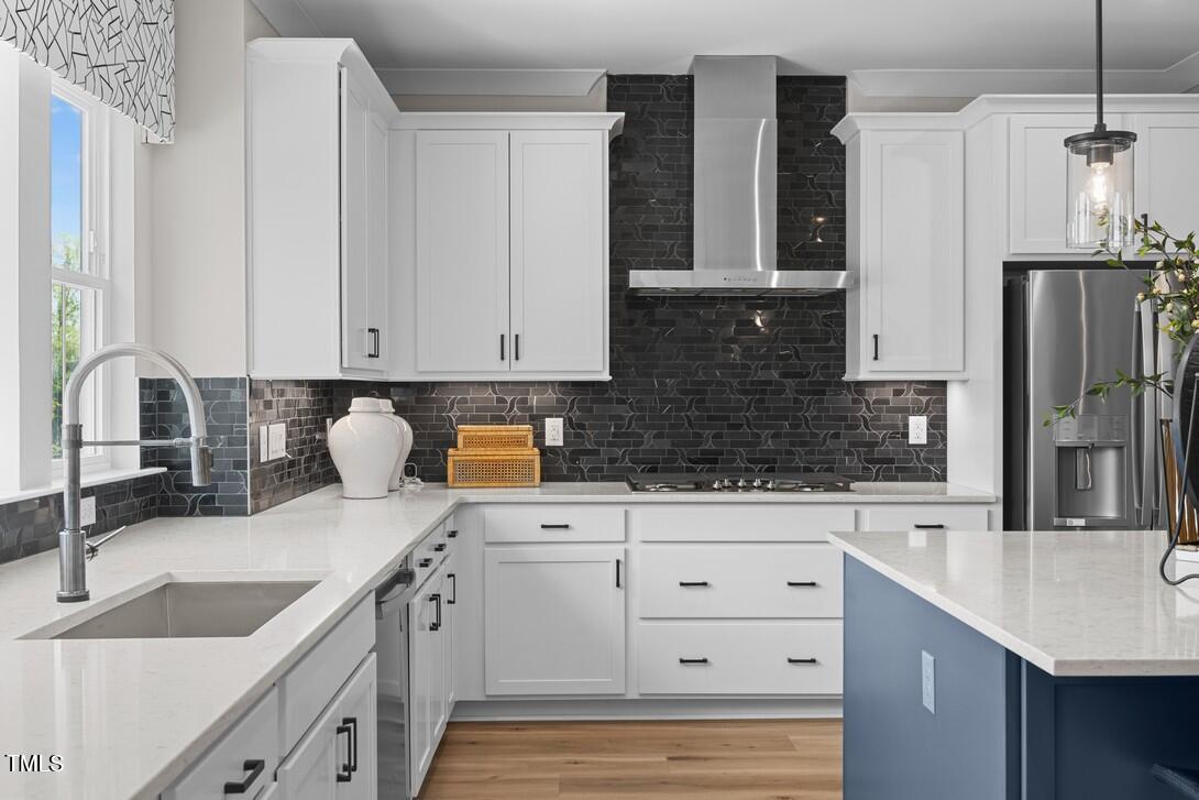 4504 Mint Leaf Lane Raleigh, NC 27612 - Photo 20 of 42 a kitchen with stainless steel appliances granite countertop a sink stove and refrigerator