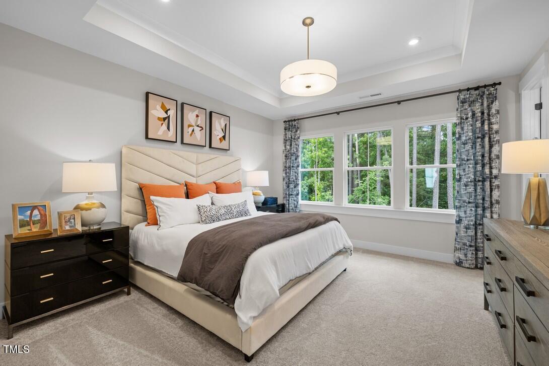 4504 Mint Leaf Lane Raleigh, NC 27612 - Photo 34 of 42 a bed room with a bed and a large window