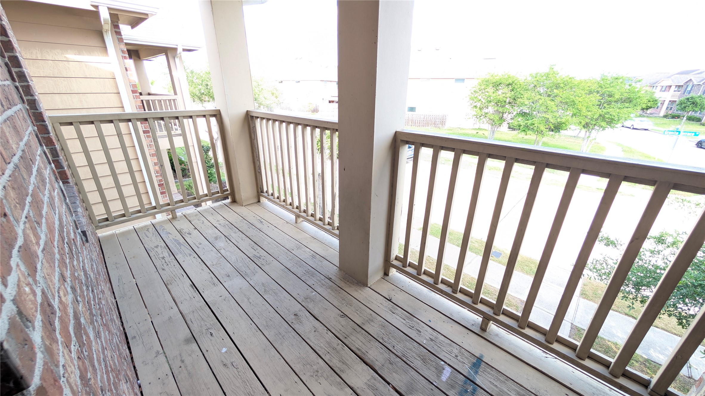 7326 Granite Terrace Lane Houston, TX 77083 - Photo 28 of 39 a view of a balcony with wooden floor