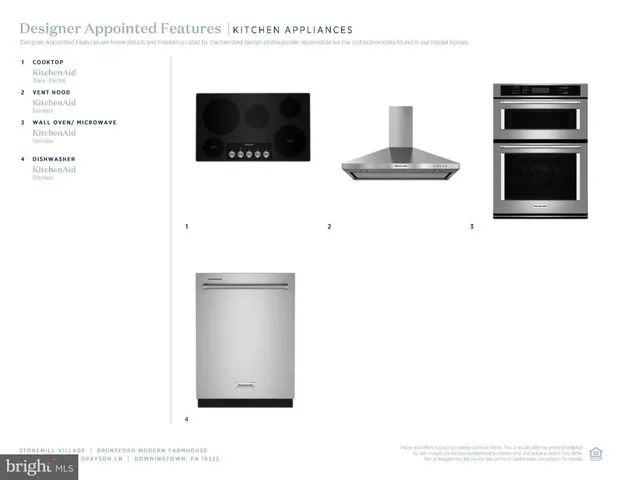 a living room with a flat screen tv and kitchen view