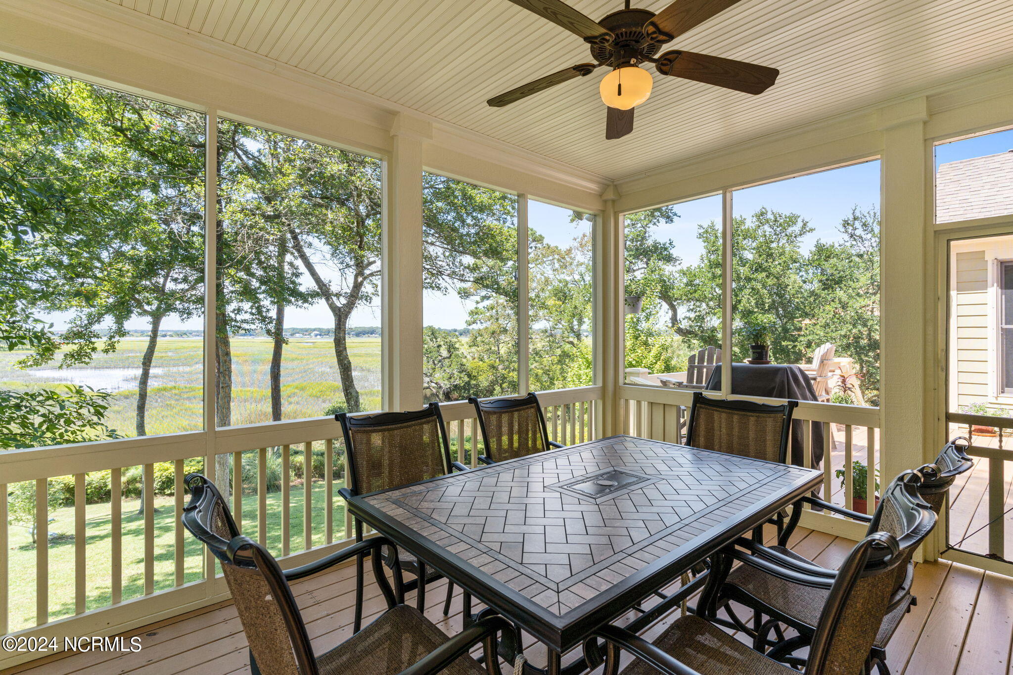2137 Lands End Way Supply, NC 28462 - Photo 22 of 57 Screened porch with ceiling fan.