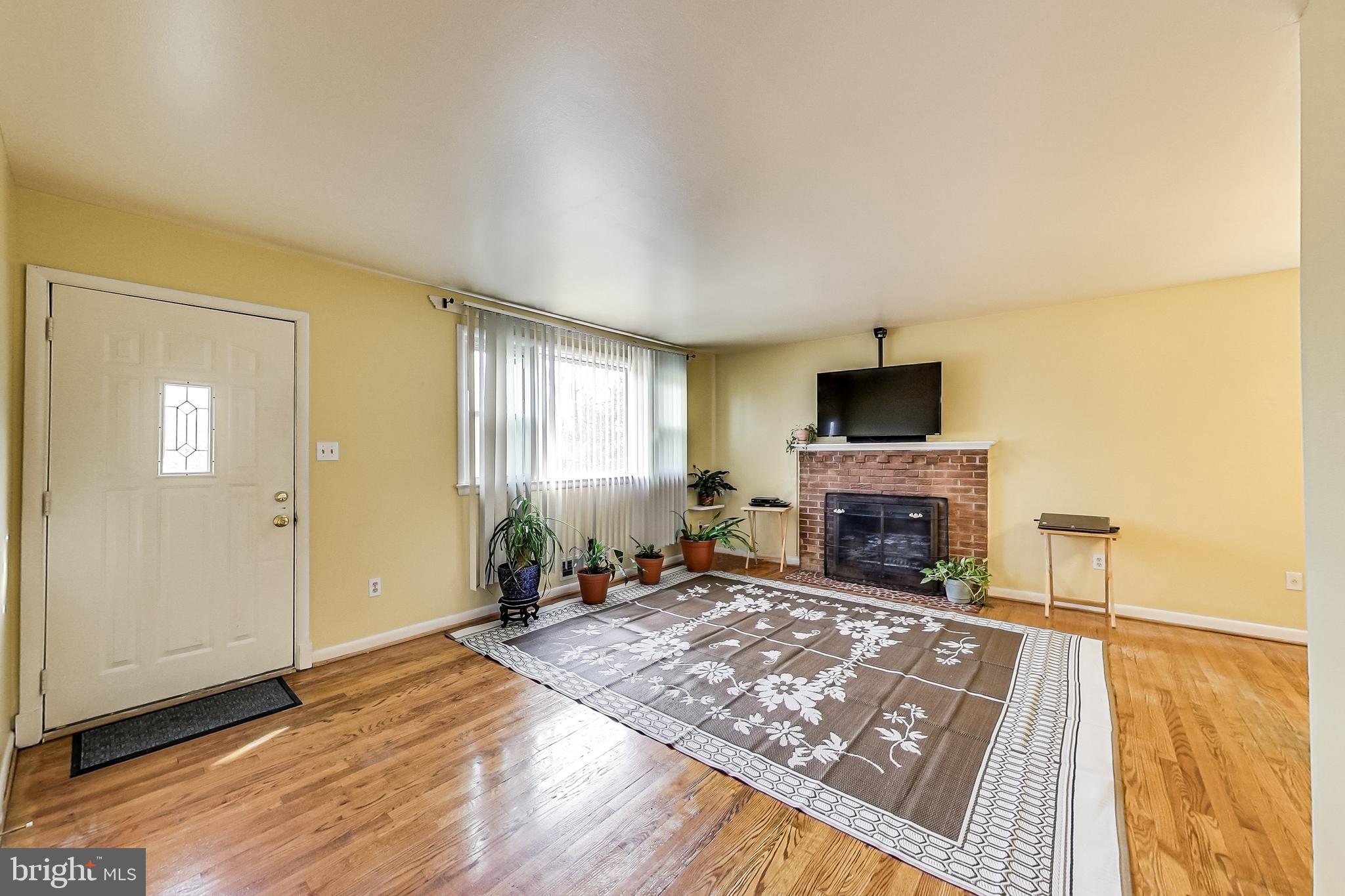 7307 Loch Raven Road Temple Hills, MD 20748 - Photo 3 of 35 Living room/ fireplace
