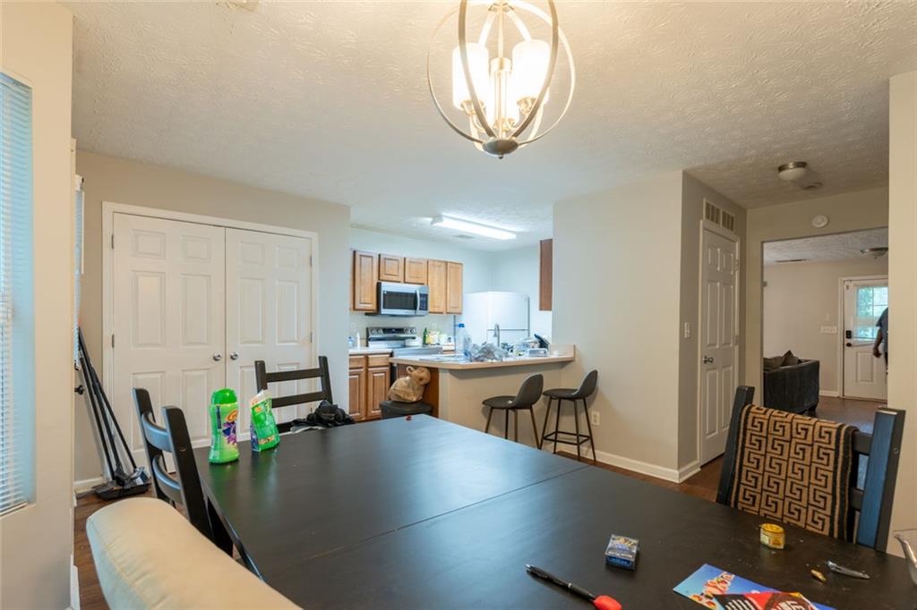3474 Waldrop Trail Decatur, GA 30034 - Photo 6 of 17 a view of a dining room with furniture and wooden floor