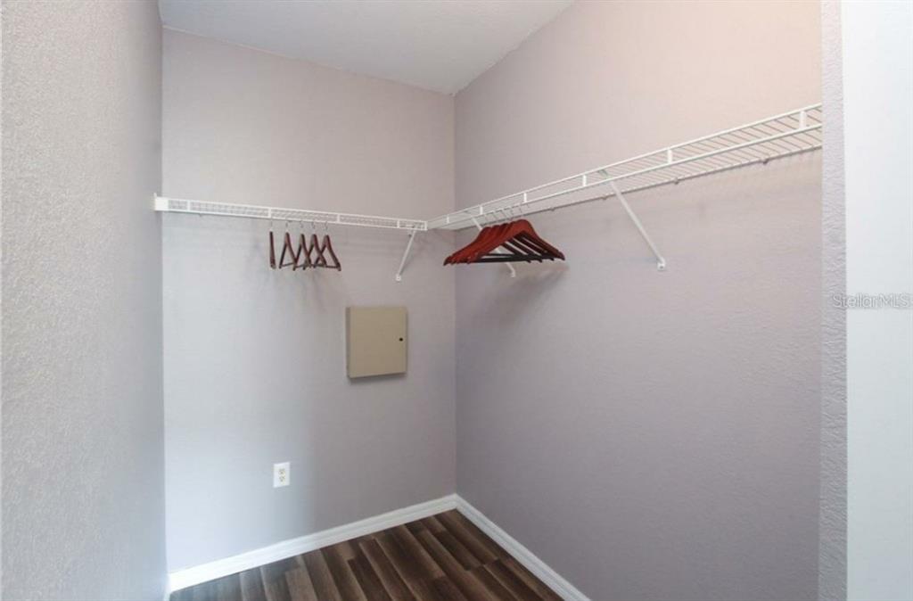 5550 East Michigan Street, Unit 3120 Orlando, FL 32822 - Photo 13 of 17 a view of walk in closet with empty racks