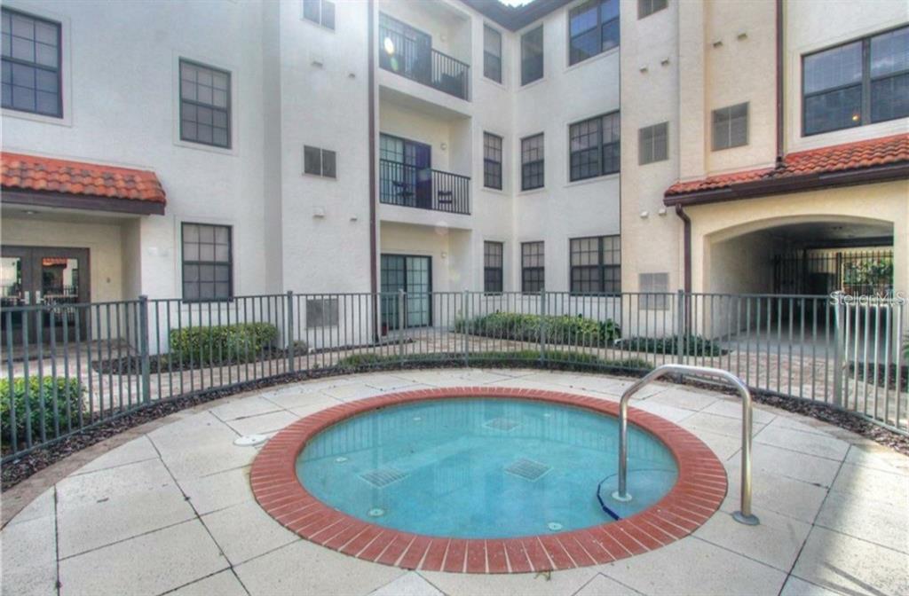 5550 East Michigan Street, Unit 3120 Orlando, FL 32822 - Photo 17 of 17 a view of a house with swimming pool