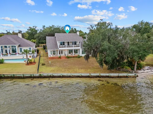 a view of a lake with a house in the background