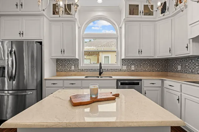 a view of a dining room with furniture wooden floor and chandelier