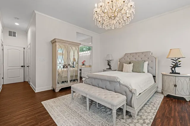 a view of an entryway with wooden floor fireplace and a window