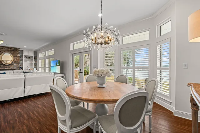 a view of an entryway with wooden floor mirror and a fire place