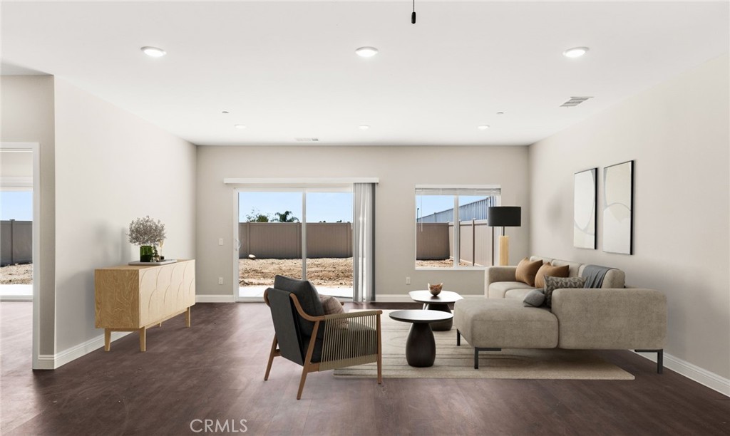 1243 Ansley Lane Mentone, CA 92359 - Photo 8 of 24 a living room with furniture and a large window