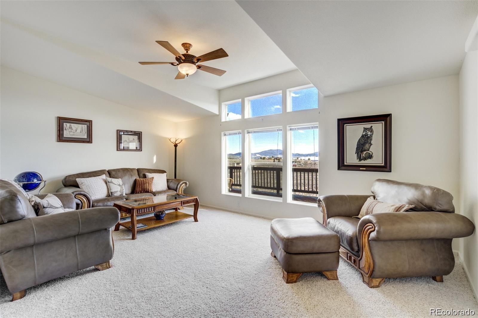 688 Tiara Road Lake George, CO 80827 - Photo 12 of 46 a living room with furniture and a large window