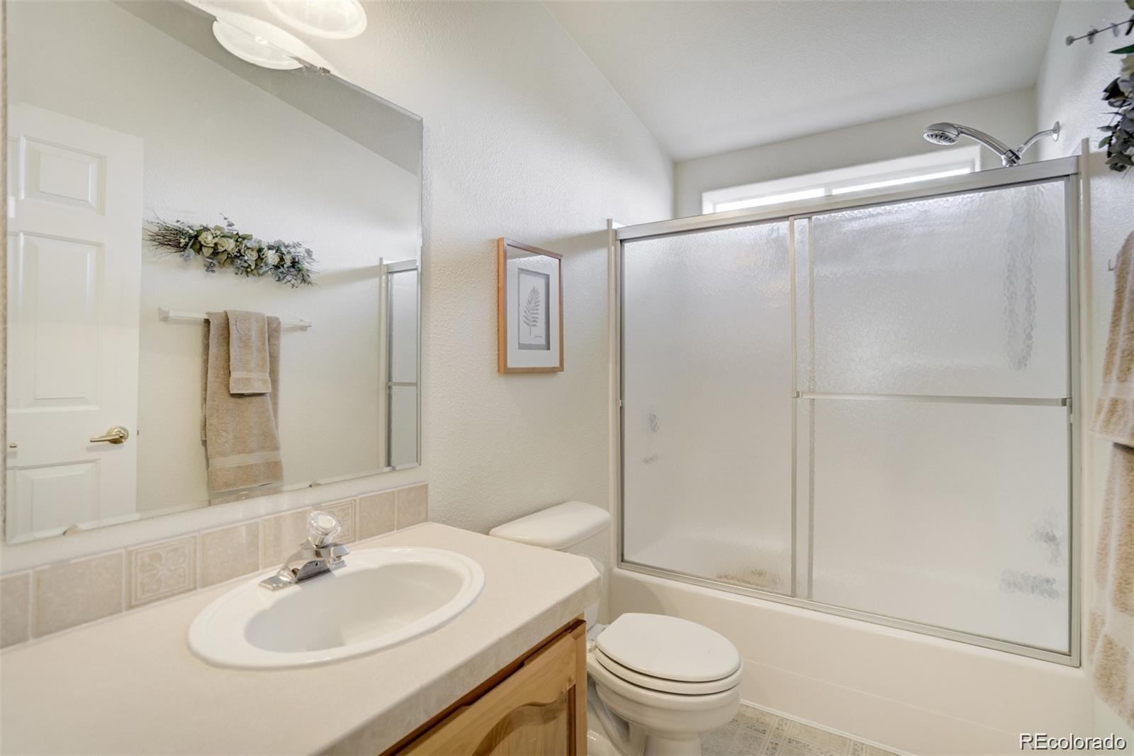 688 Tiara Road Lake George, CO 80827 - Photo 21 of 46 a bathroom with a sink toilet and shower