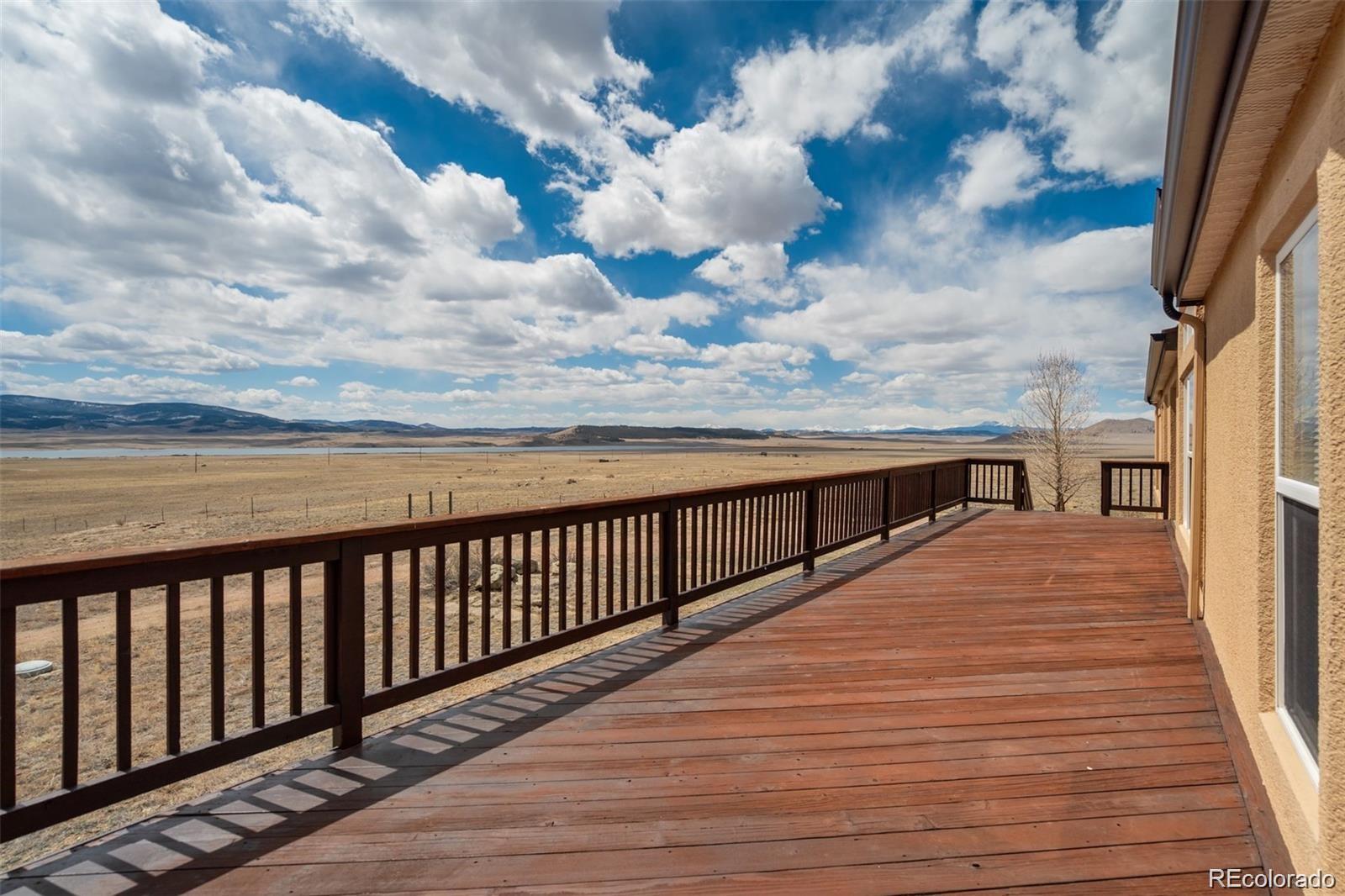 688 Tiara Road Lake George, CO 80827 - Photo 23 of 46 a view of a balcony with wooden floor