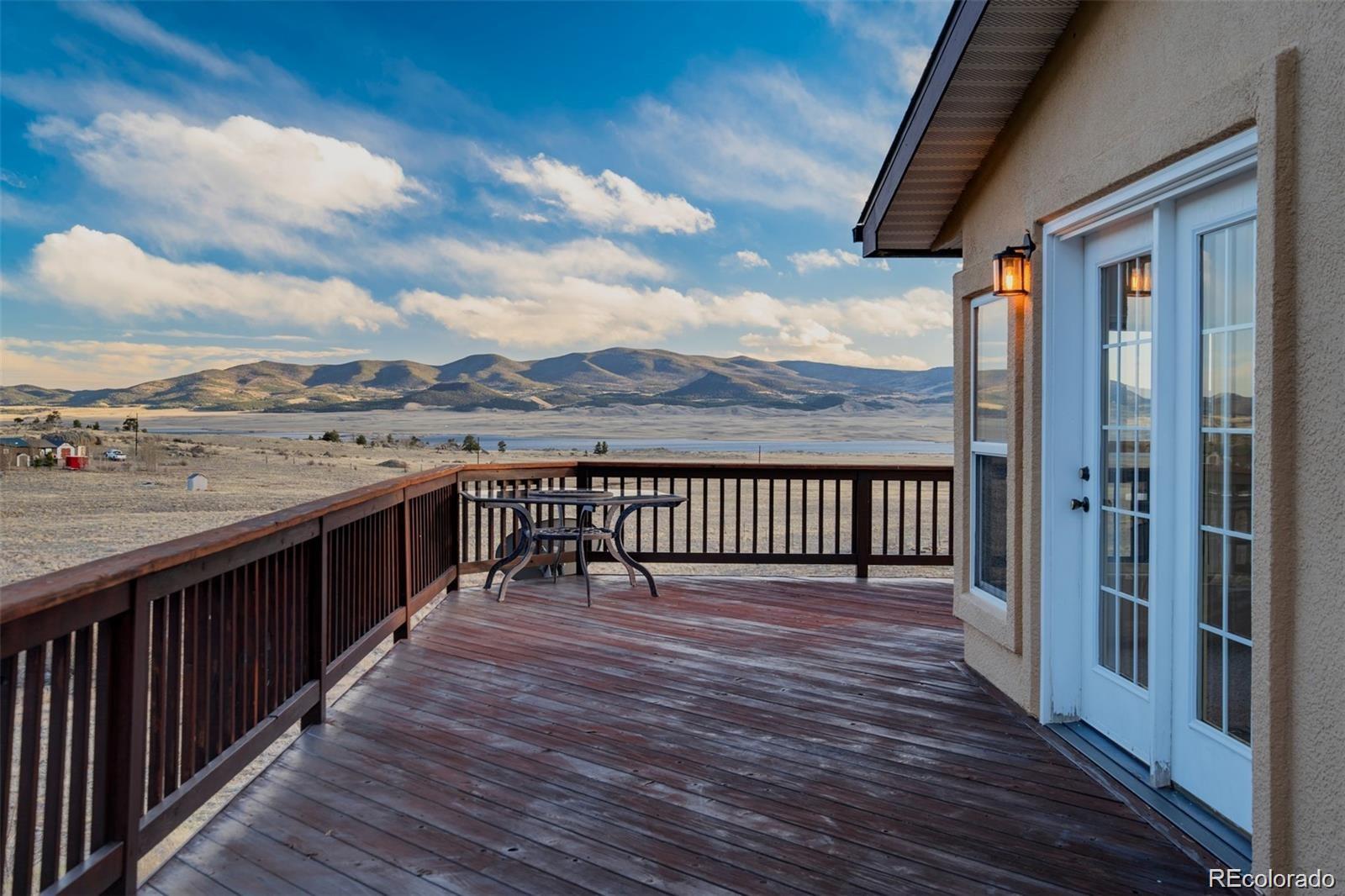 688 Tiara Road Lake George, CO 80827 - Photo 25 of 46 a view of a balcony with wooden floor