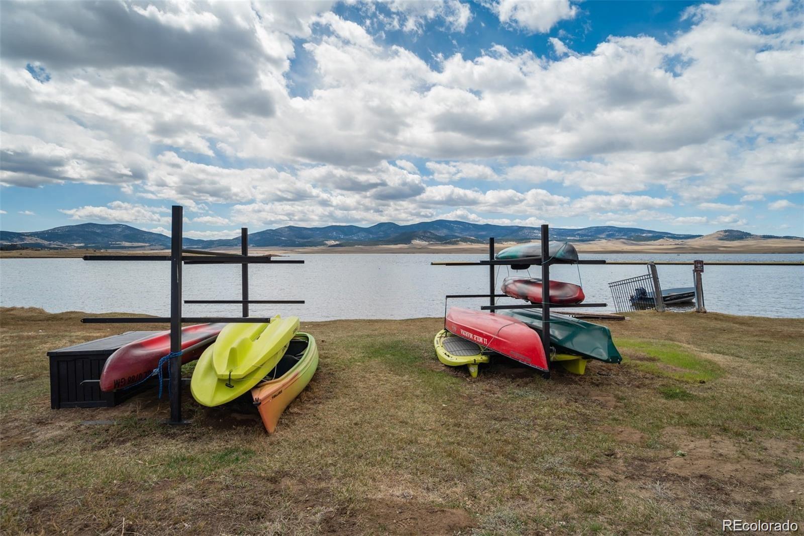 688 Tiara Road Lake George, CO 80827 - Photo 36 of 46 a view of a swimming pool with lawn chairs