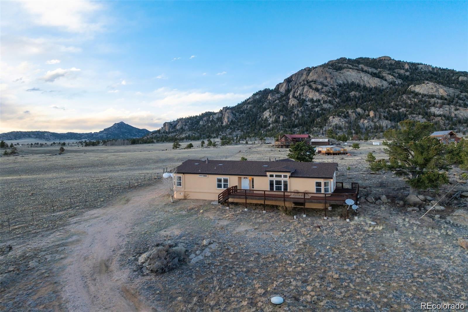 688 Tiara Road Lake George, CO 80827 - Photo 40 of 46 a view of a lake with mountain in the background