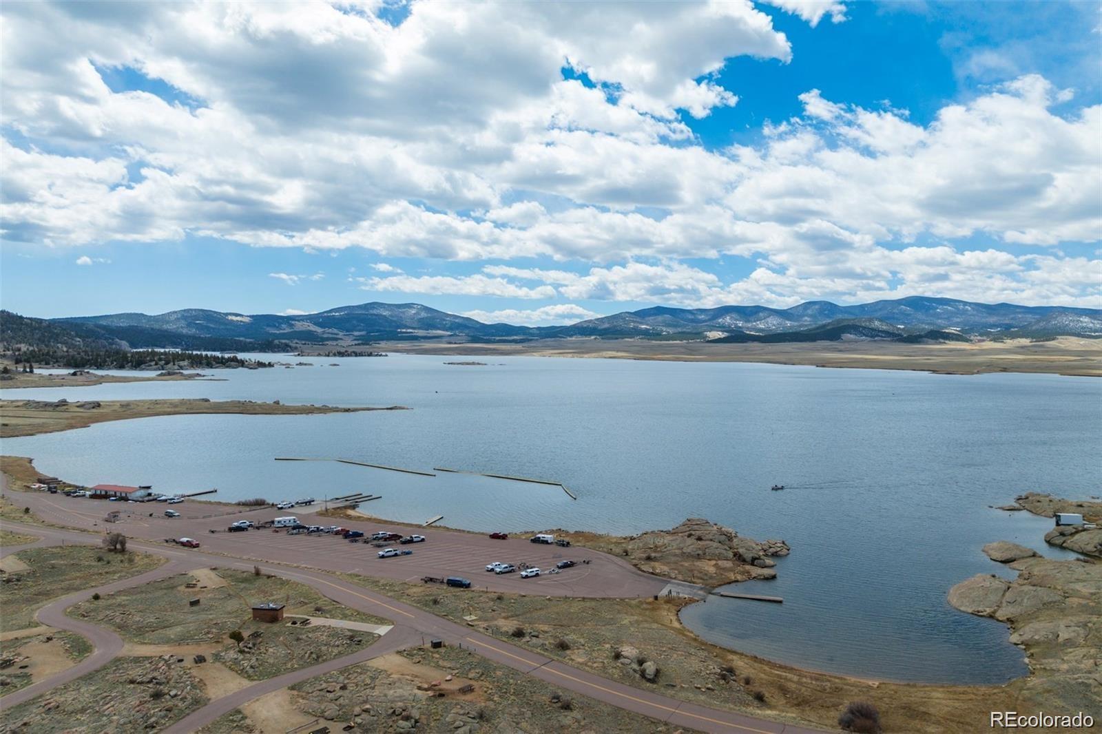 688 Tiara Road Lake George, CO 80827 - Photo 44 of 46 a view of a lake with beach and city view