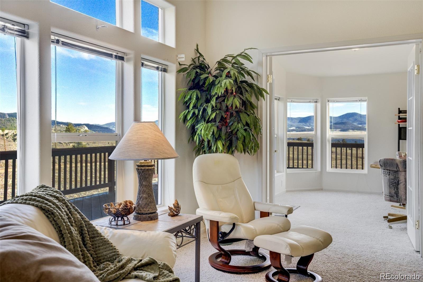 688 Tiara Road Lake George, CO 80827 - Photo 6 of 46 a living room with furniture and a window