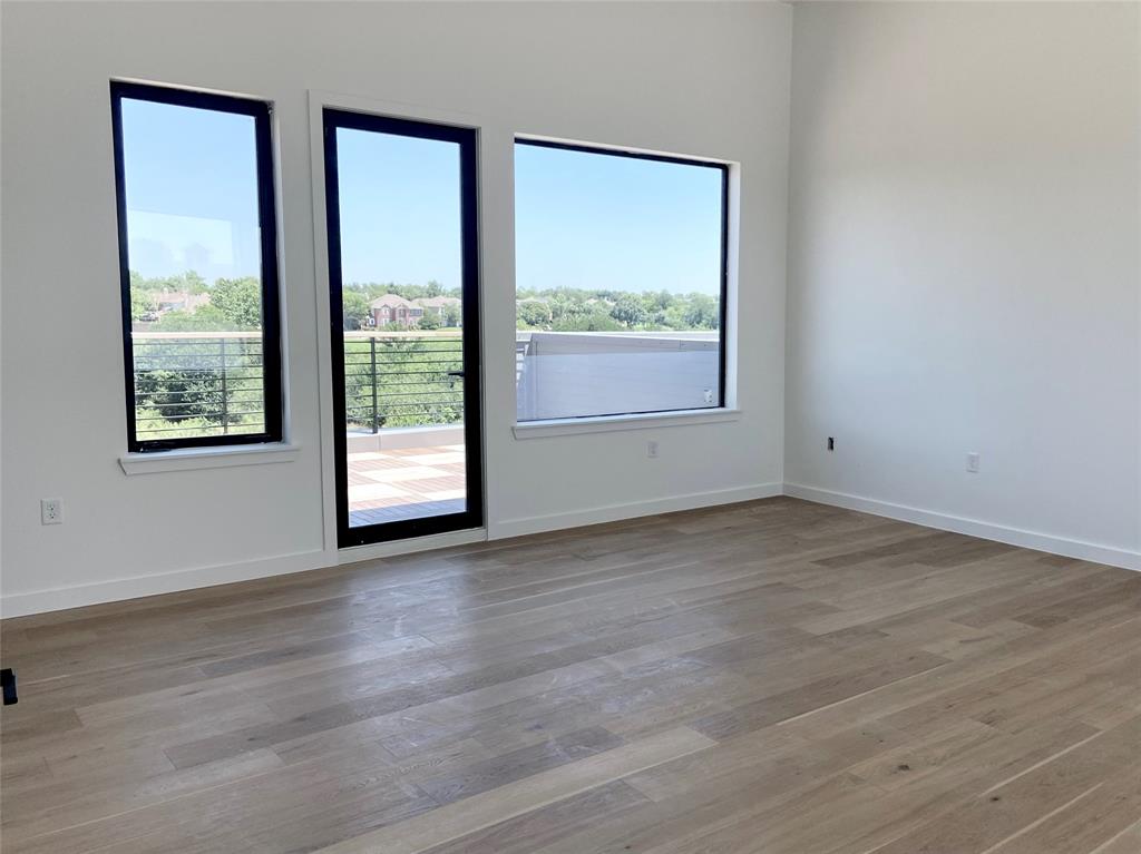1111 Raiford Road, Unit 128 Carrollton, TX 75007 - Photo 11 of 18 This third-floor 22x17 private suite or family room opens to the rooftop terrace. It can be accessed by stairs or elevator making this the perfect multi-generational home. (construction photos - professional photos upon completion)