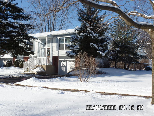 346 Rockhurst Road Bolingbrook, IL 60440 - Photo 2 of 19 a view of a house with snow on the wall