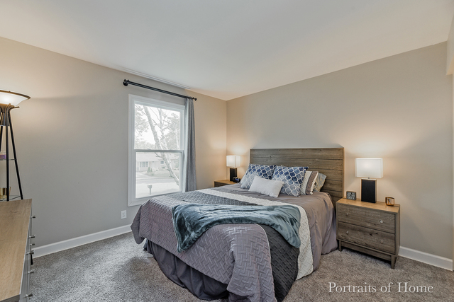 346 Rockhurst Road Bolingbrook, IL 60440 - Photo 12 of 19 a bedroom with a bed and a window