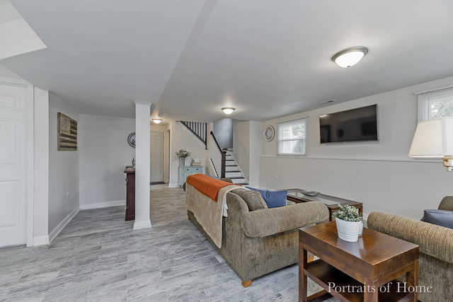 346 Rockhurst Road Bolingbrook, IL 60440 - Photo 17 of 19 a living room with furniture and a wooden floor