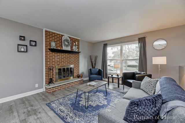 346 Rockhurst Road Bolingbrook, IL 60440 - Photo 6 of 19 a living room with furniture a rug a window and a fireplace