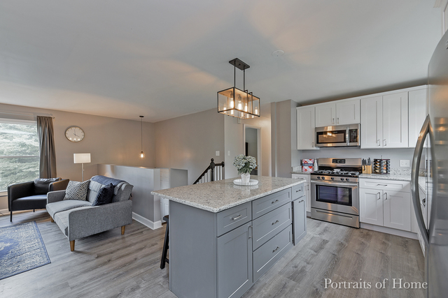 346 Rockhurst Road Bolingbrook, IL 60440 - Photo 7 of 19 a kitchen with a sink stove and refrigerator