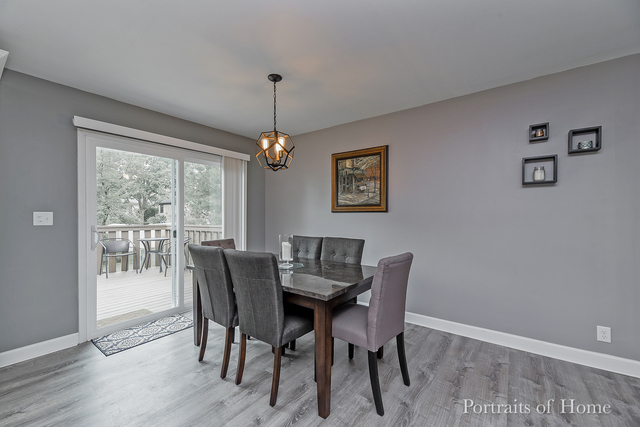 346 Rockhurst Road Bolingbrook, IL 60440 - Photo 10 of 19 a view of a dining room with furniture wooden floor and chandelier
