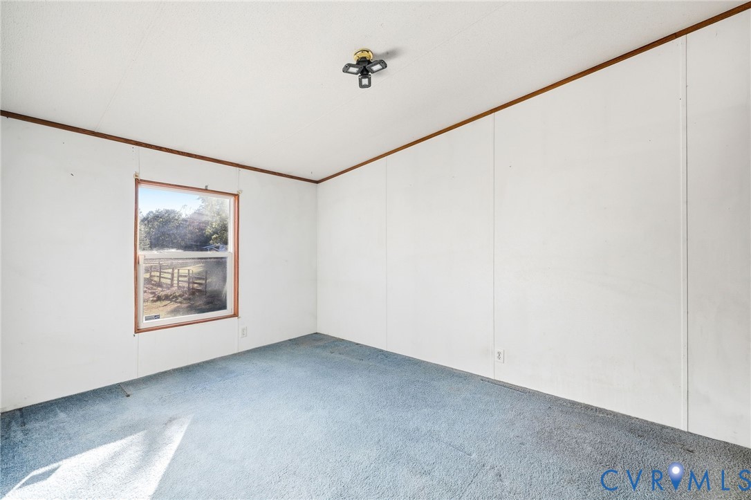 7410 Richmond Road Amelia Court House, VA 23002 - Photo 19 of 39 a view of a big room with closet and windows